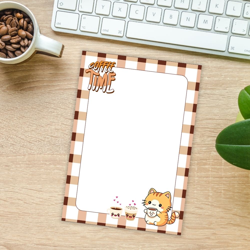 Notebook with 'Coffee Time' design on a desk with coffee beans and a keyboard.COFFEE TIME KAWAII CAT A6 NOTEPAD