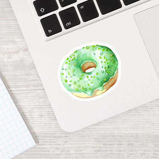 Green donut sticker on a laptop keyboard. CUPCAKE STICKERs