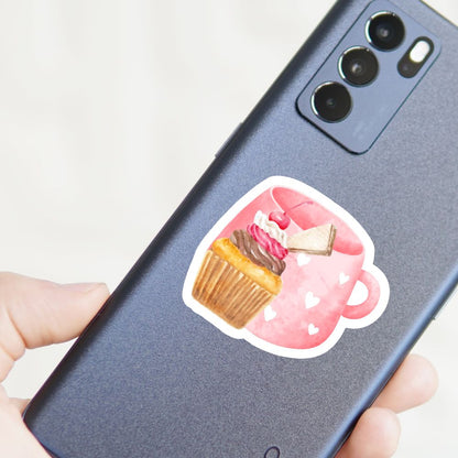 Phone case with a cupcake design held by a hand. Cherry Cupcake Sticker