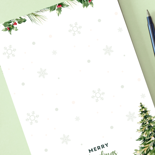 Holiday-themed stationery with holly leaves, snowflakes, and a pen on a green background. Christmas Tree Notepad A6