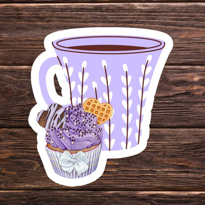Sticker of a purple cup with a cupcake and waffle on a wooden background. Coffee and Blueberry Cupcake Sticker