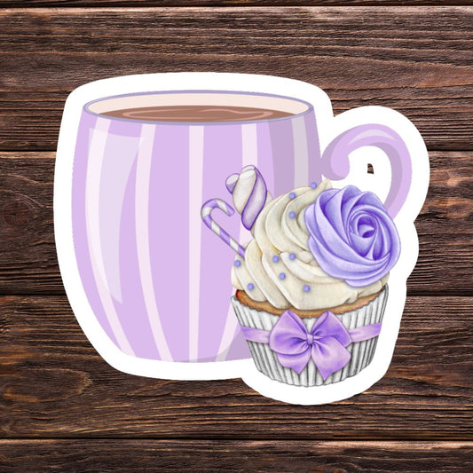 Sticker of a purple striped mug with a cupcake design on a wooden surface. Coffee with Creamy Lilac Cupcake Sticker