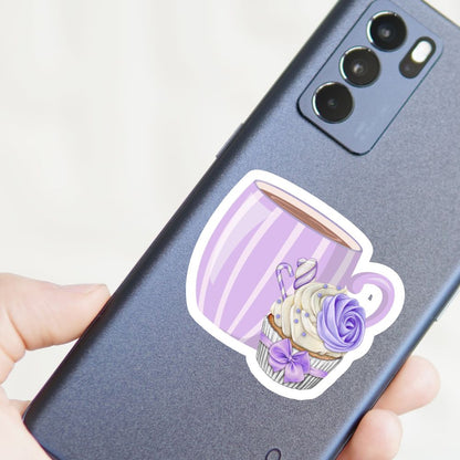 Phone case with a purple cup and flower design held by a hand. Coffee with Creamy Lilac Cupcake Sticker