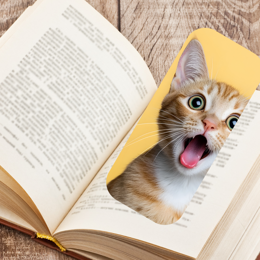 Open book with a yellow bookmark featuring a cat's face. Cute Cats Oval Bookmark Set