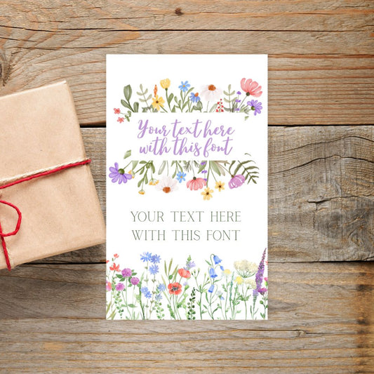 Card with floral design and text space on a wooden surface with a gift box.FLORAL PERSONALISED GIFT TAG
