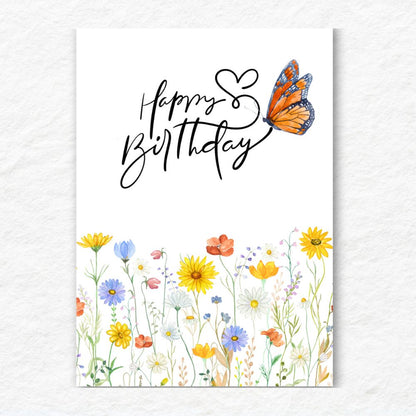 Happy Birthday card with colorful flowers and a butterfly on a white background. Flower Field Happy Birthday Card