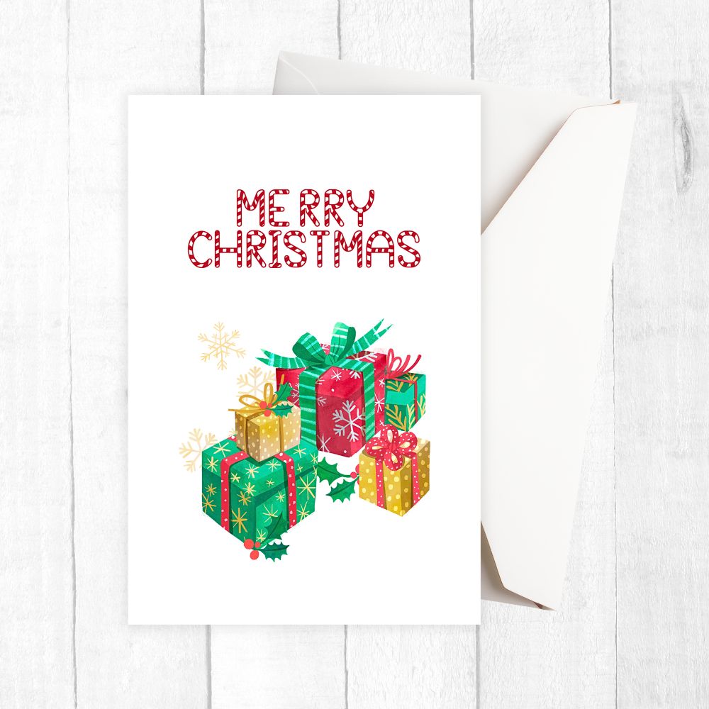 Christmas-themed towel with 'Merry Christmas' text and gift illustrations on a white background. GIFTS CHRISTMAS CARD
