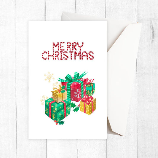 Christmas-themed towel with 'Merry Christmas' text and gift illustrations on a white background. GIFTS CHRISTMAS CARD