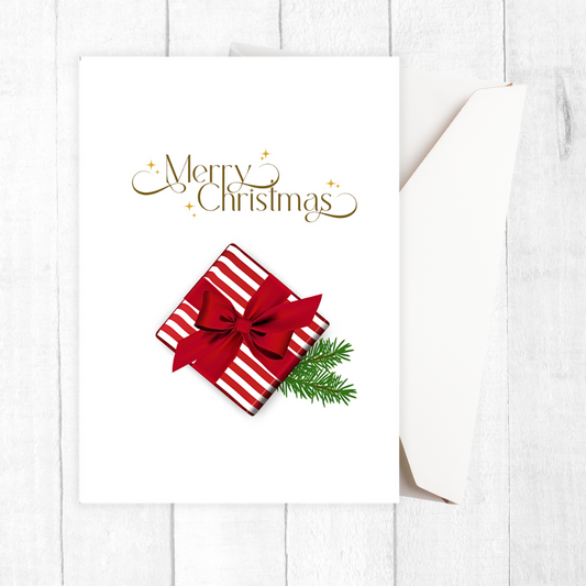Christmas card with red gift box, green bow, and 'Merry Christmas' text on a white background. Gift with Bow Christmas Card