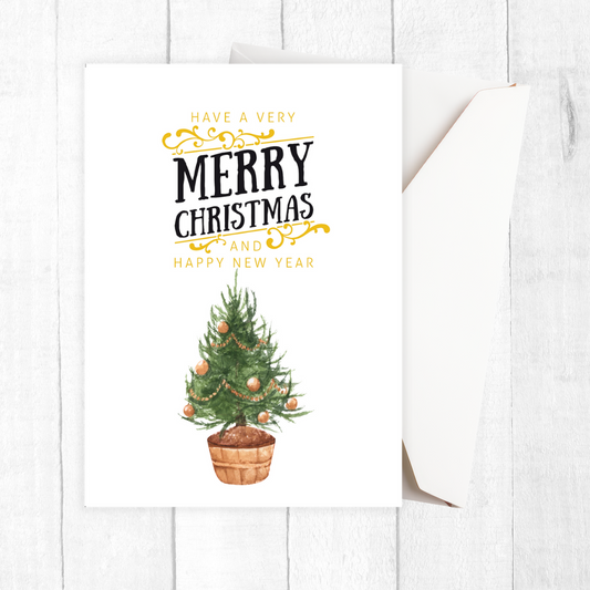 Christmas card with a potted Christmas tree and festive text on a white background. Golden Tree Christmas Card