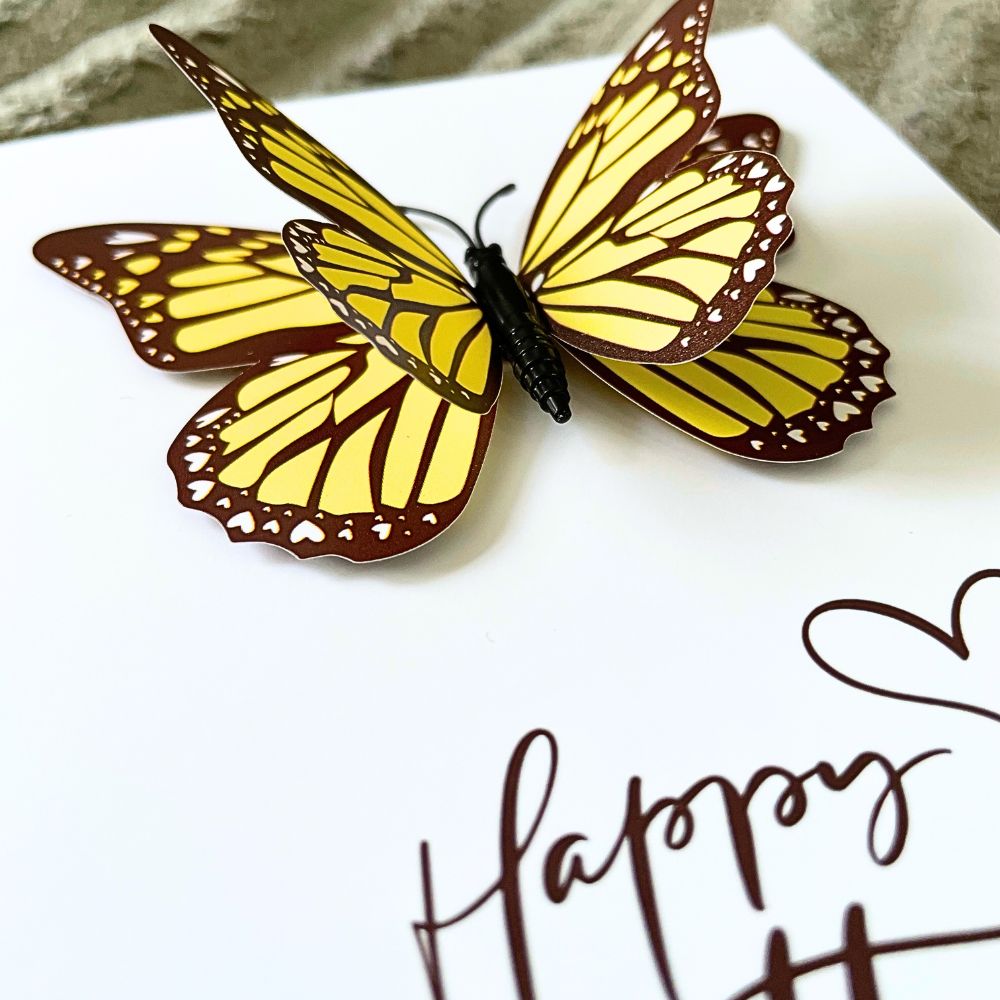 Yellow and brown butterfly on a white surface with 'Happy' text. HAPPY BIRTHDAY 3D BUTTERFLY CARD