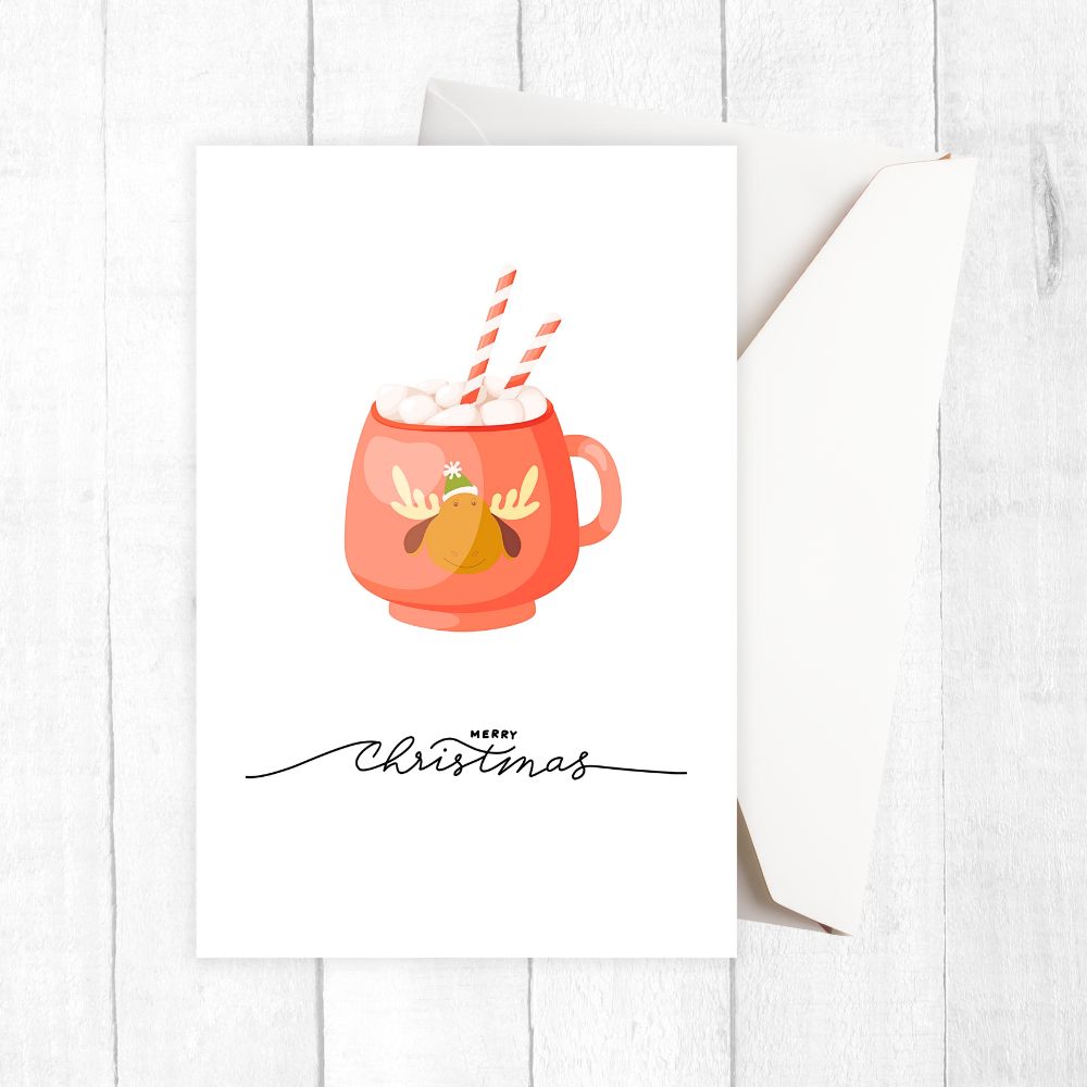 Christmas-themed mug with reindeer design and 'Merry Christmas' text on a white background. HOT COCOA CHRISTMAS CARDS