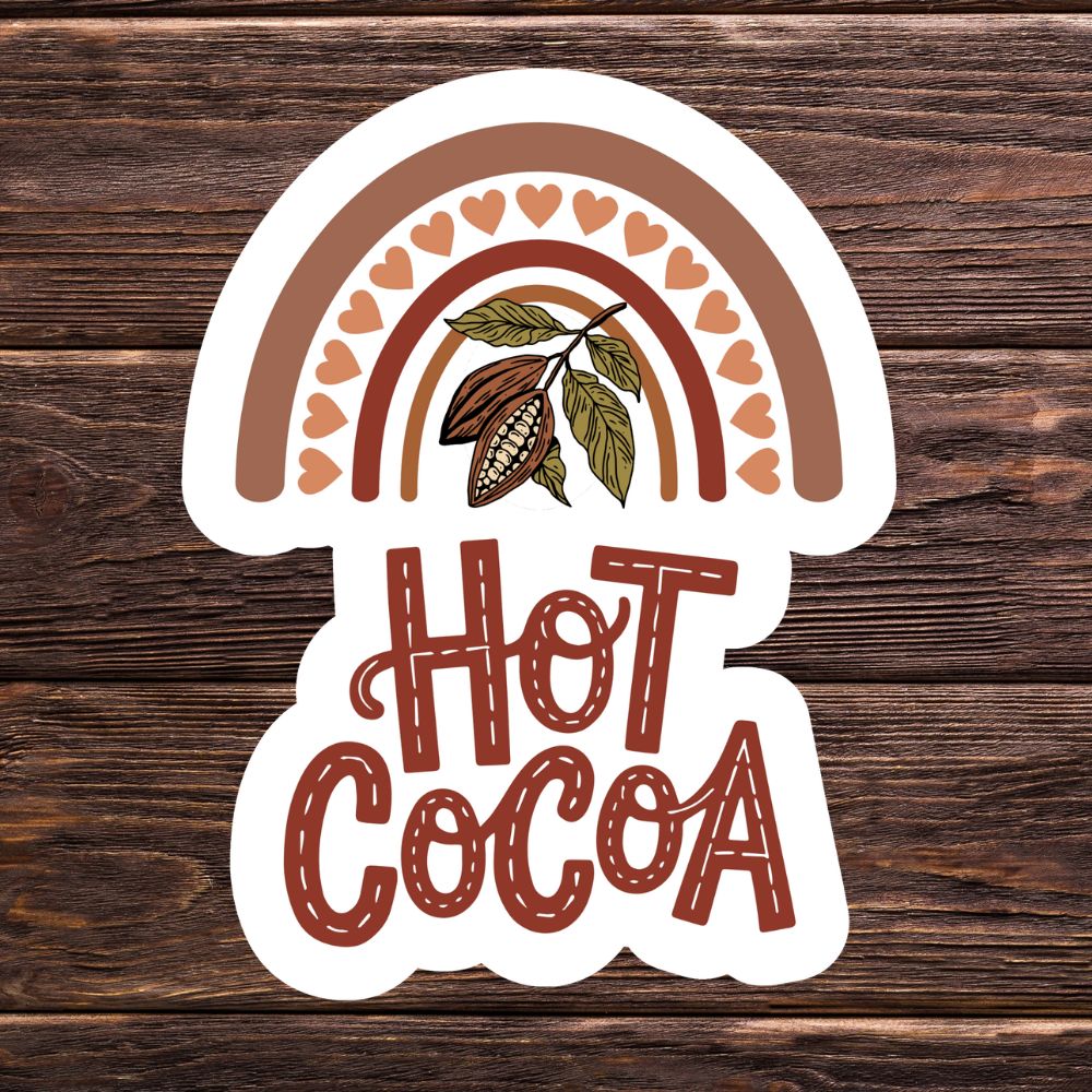 Sticker with 'Hot Cocoa' text and cacao bean design on a wooden background. HOT COCOA STICKER