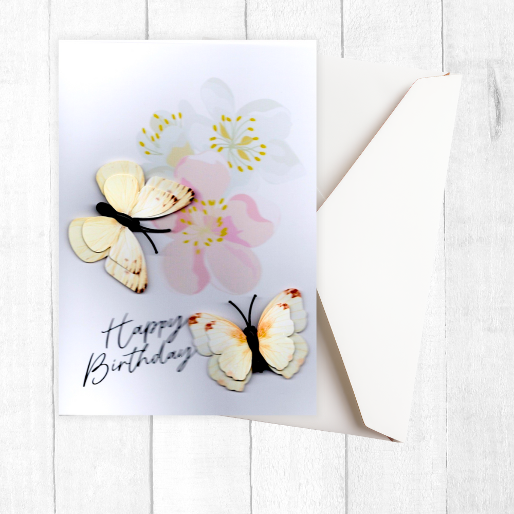 Greeting card with butterflies and flowers on a white background