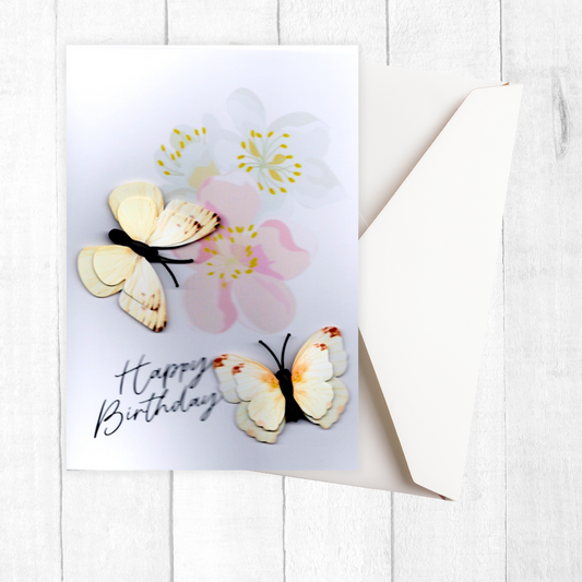 Greeting card with butterflies and flowers on a white background