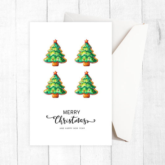 Four Christmas tree-shaped cookies on a white card with 'Merry Christmas and Happy New Year' text. LITTLE TREES CHRISTMAS CARD