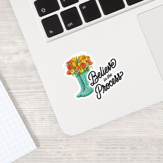 Sticker with flowers and 'Believe in the Process' text on a laptop. Motivational Quotes Sticker Sheet