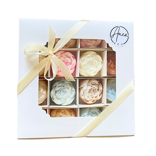 Set of floral soap bars in a decorative box with a bow, featuring the brand 'Anea & Co'.PEONIES WAX MELTS GIFT BOX