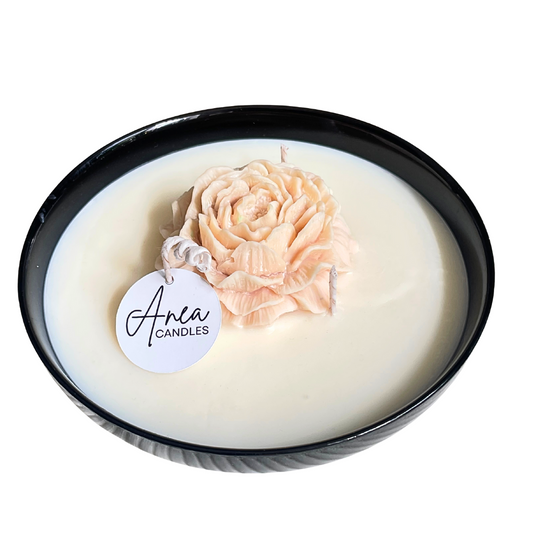 Candle with a rose inside and 'Anea Candles' label on a white background. PEONY FLOWER SOY NTURAL CANDLE