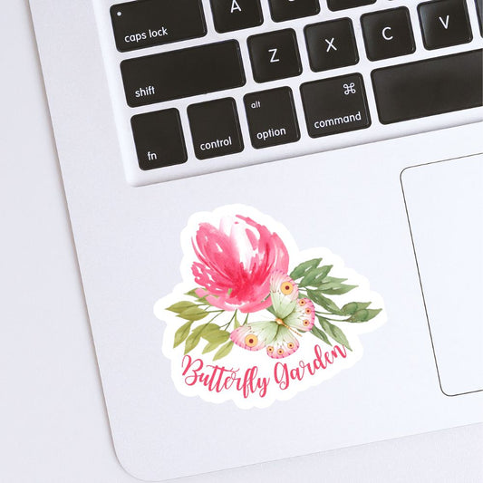 Floral sticker with 'Butterfly Garden' text on a laptop keyboard. Peony and Butterfly Garden Sticker