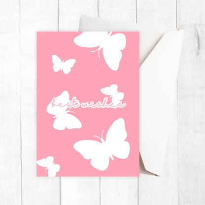 PURPLE Butterflies Best Wishes Greeting Card with white butterflies and 'best wishes' text on a white wooden surface