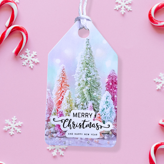 Gift tag with Christmas tree design and 'Merry Christmas and Happy New Year' text on a pink background with candy canes and snowflakes.Pink Christmas Gift Tag Set