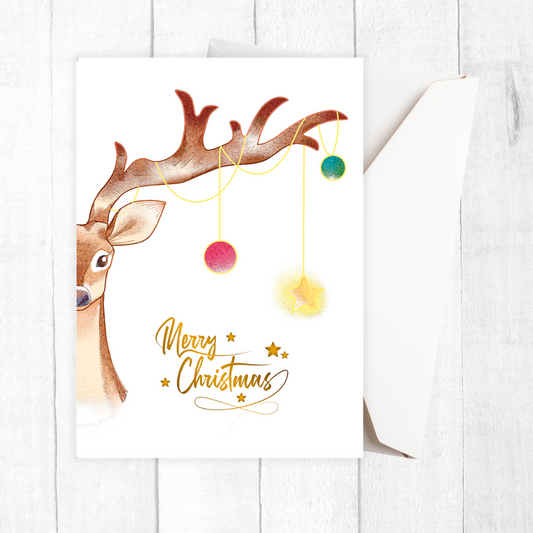 Christmas card with a reindeer and colorful ornaments on a white background. Reindeer Tree Christmas Card