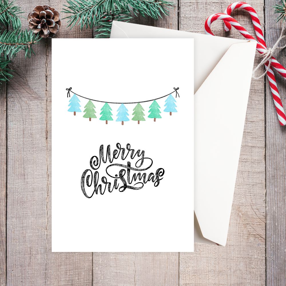 Christmas card with festive design on a wooden surface.  SIMPLE CHRISTMAS CARD 