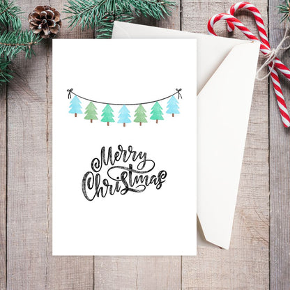 Christmas card with festive design on a wooden surface.  SIMPLE CHRISTMAS CARD 