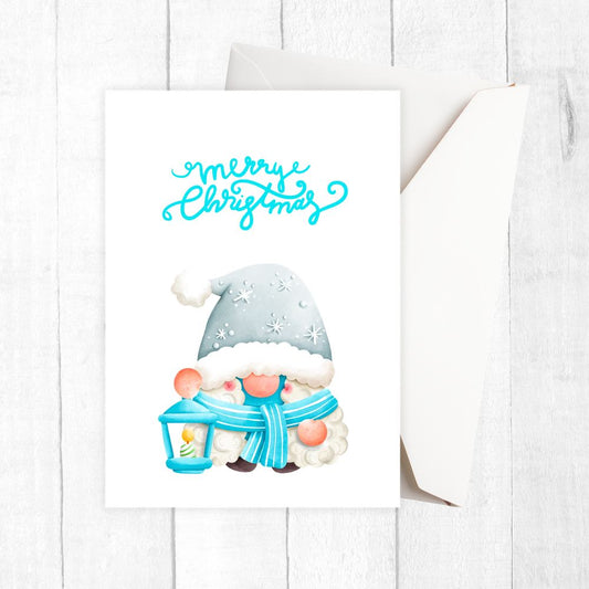 Gnome with a blue scarf and lantern on a white background with 'Merry Christmas' text.SKY GNOME CHRISTMAS CARD