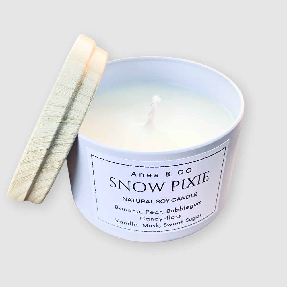 Snow Pixie candle with a wooden lid on a light background. SNOW PIXIE SOY CANDLE
