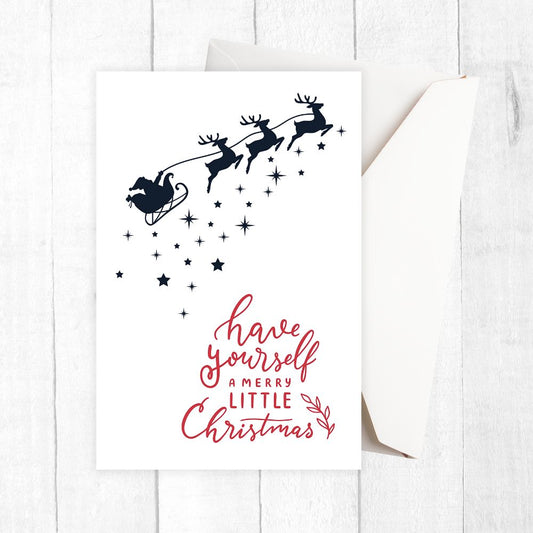 Christmas-themed card with Santa and reindeer silhouette and red text on a white background. STARRY NIGHT CHRISTMAS CARD