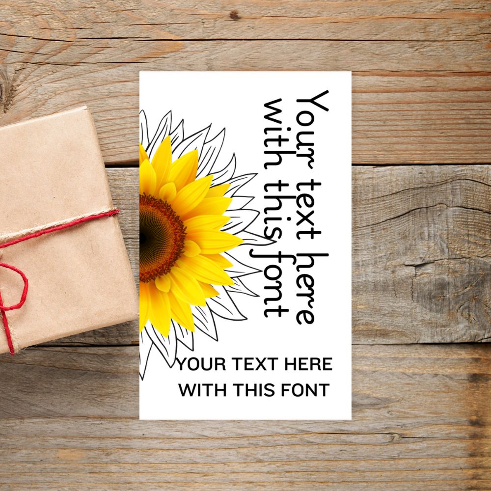 Sunflower design with text placeholder on a wooden surface. SUNFLOWER PERSONALISED GIFT TAG