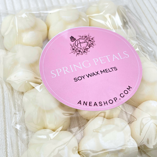 Packaged soy wax melts with a pink label on a white background. VANILLA SPRING PETALS CREAM WAX MELTS 