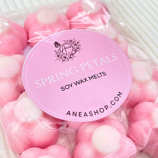 Pink soy wax melts with a brand label on a white background. VANILLA SPRING PETALS PINK WAX MELTS 