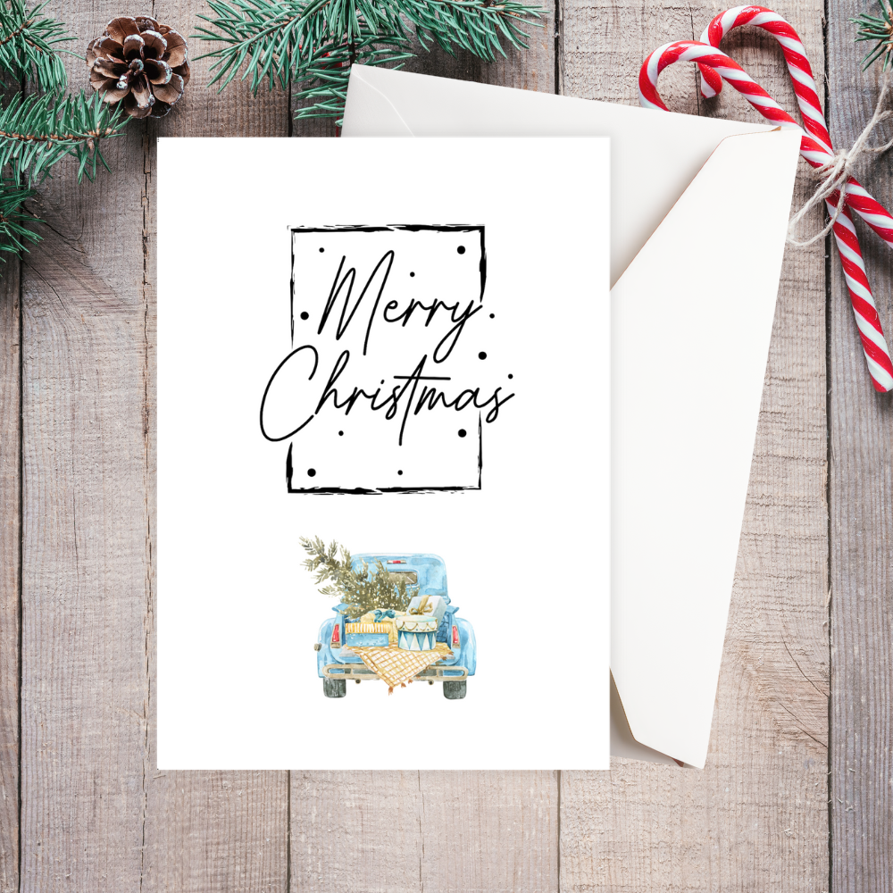 Christmas card with 'Merry Christmas' text and a car illustration on a wooden surface with festive decorations. Vintage Car Christmas Card