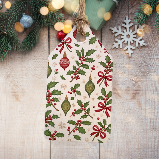 Christmas-themed decorative tag with holly and bow design on a wooden surface with festive decorations.Vintage Christmas Gift Tag Set