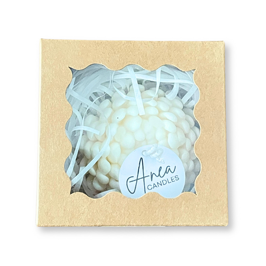 White candle in a decorative box with 'Anea Candles' label on a white background. PEONY SNOW PIXIE SOY CANDLE