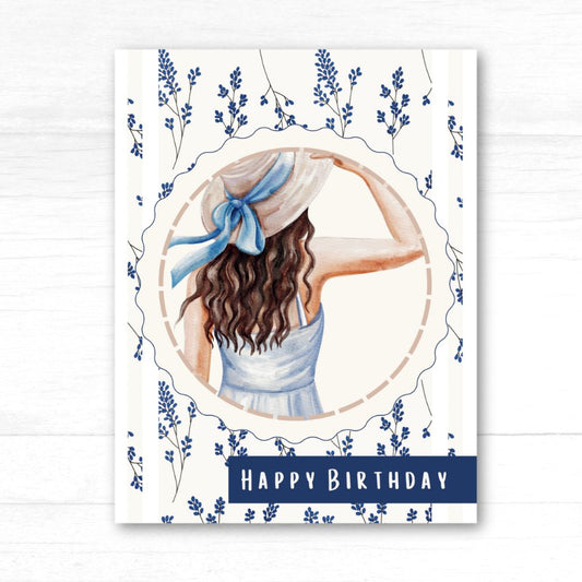 Birthday card with a woman in a hat and dress surrounded by flowers and the text 'Happy Birthday'. Wild Flowers Happy Birthday Card