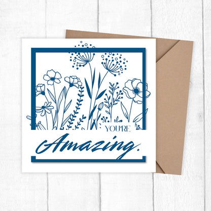 Greeting card with floral design and 'You're Amazing' text on a white background