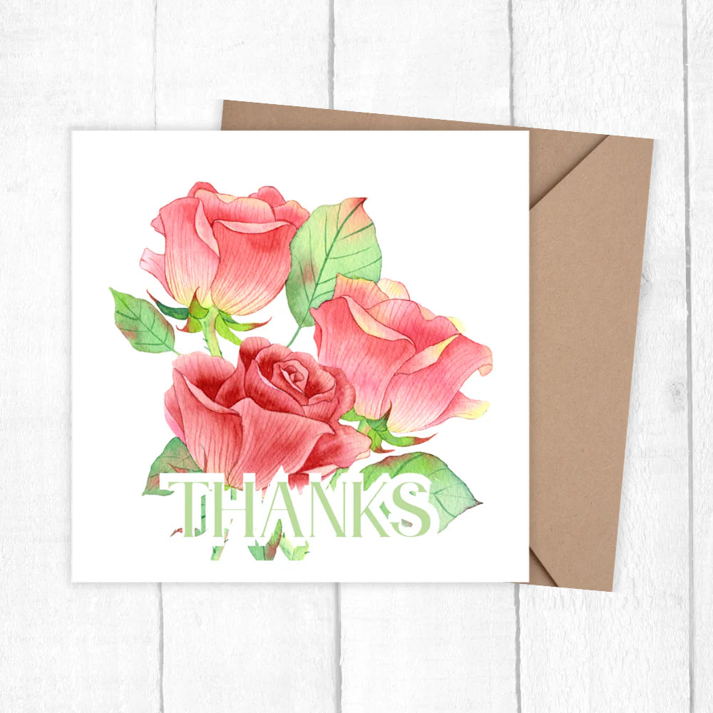 Greeting card with pink roses and 'THANKS' text on a white background