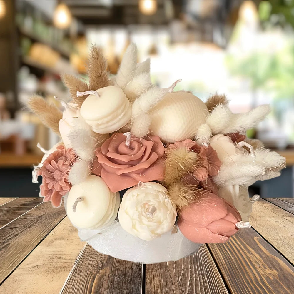 Decorative flower arrangement with pink and white flowers on a wooden table.CREAM & BROWN FLOWER CANDLES CENTREPIECE