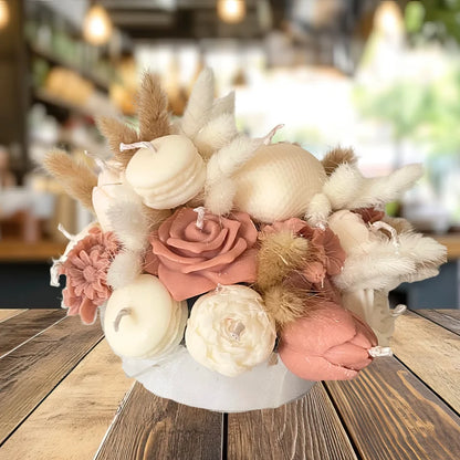Decorative flower arrangement with pink and white flowers on a wooden table.CREAM & BROWN FLOWER CANDLES CENTREPIECE