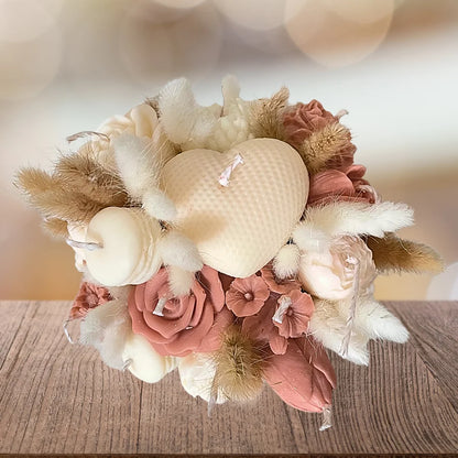 Decorative arrangement of flowers and candles on a wooden surface with a blurred background. CREAM & BROWN FLOWER CANDLES CENTREPIECE