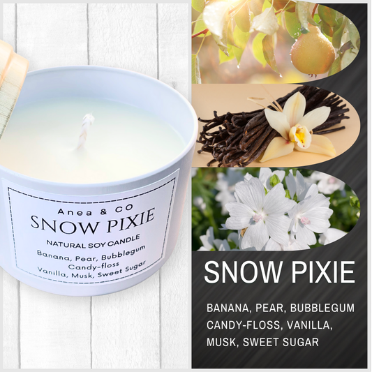 Snow Pixie candle with vanilla beans, flowers, and pear slices on a white background. SNOW PIXIE SOY CANDLE