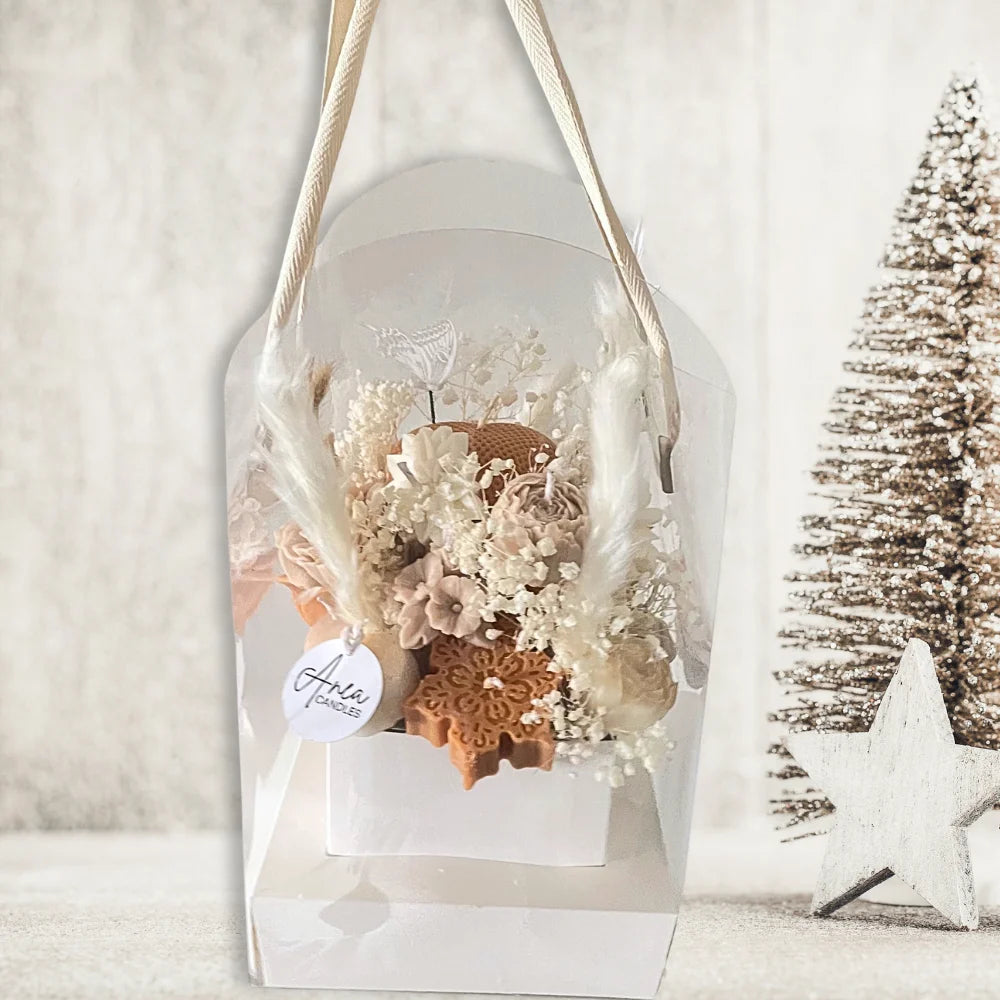 Decorative hanging plant in a clear vase with a white background. chocolatecreamchristmascandlesbouquet2