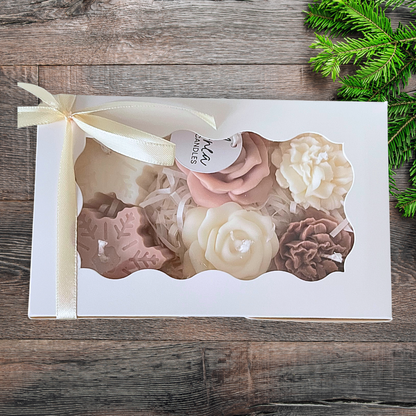 Set of floral candles in a decorative box on a wooden surface with greenery.CHRISTMAS SPICE MIXED CANDLE GIFT BOX