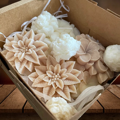 Box of flower-shaped soap bars on a wooden surface. MIXED FRAGRANCED WAX MELTS BOX