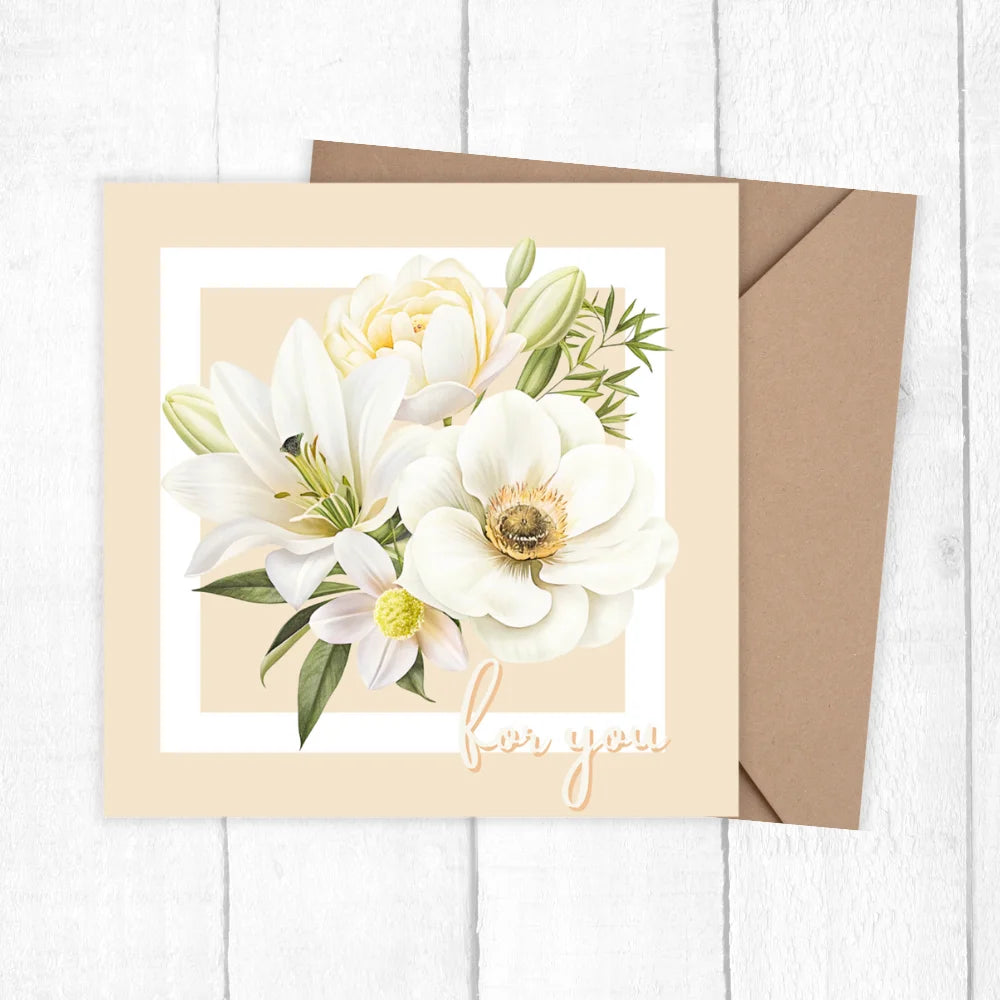 Floral card with white flowers and green leaves on a beige background, accompanied by a brown envelope.FLOWERS FOR YOU CARD