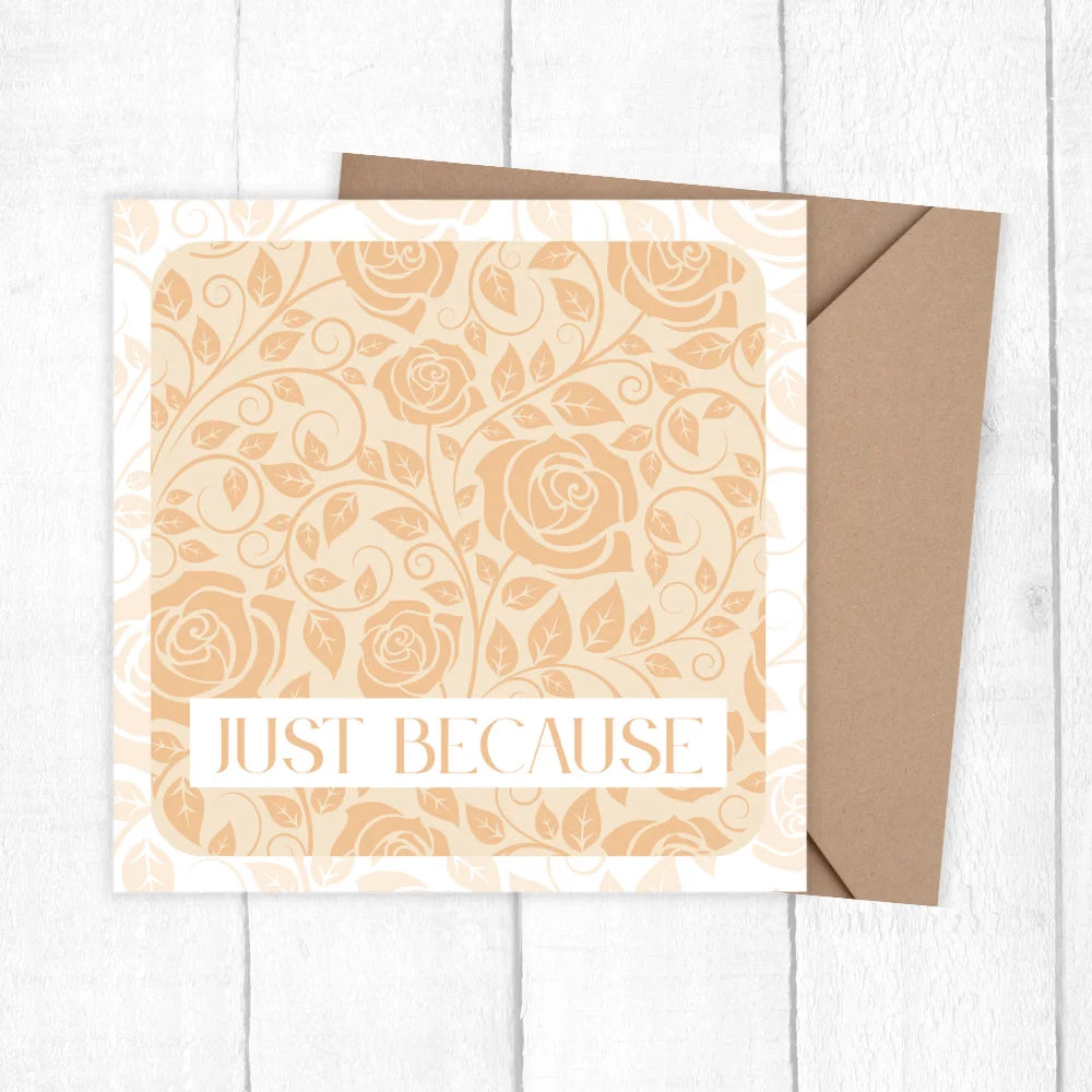Greeting card with floral design and 'Just Because' text on a white wooden surface. JUST BECAUSE CARD 
